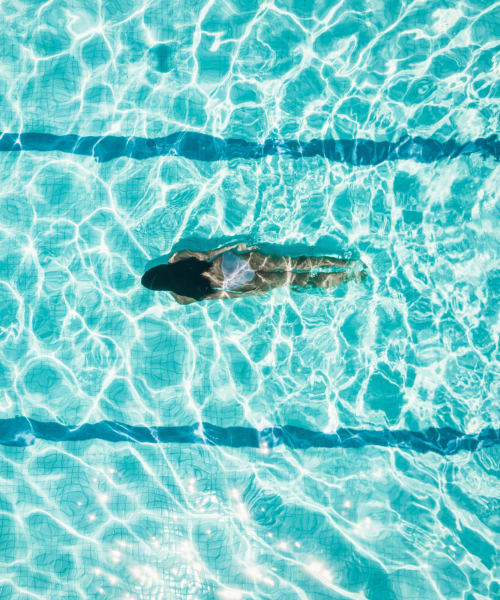 Person swimming underwater in the pool at Lyford Apartments in Tiburon, California