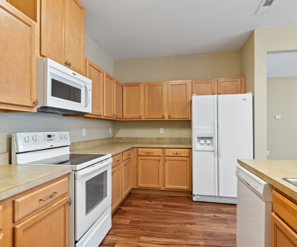 A kitchen with appliances in a home at The Village at Carolina Meadows in Chesapeake, Virginia