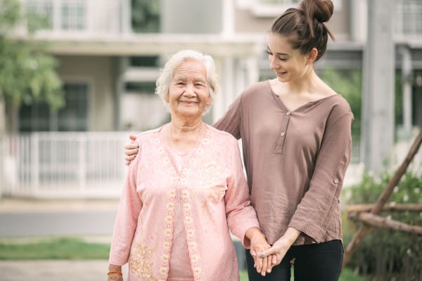 Resident and staff member at Seasons Memory Care at Rolling Hills in Torrance, California.