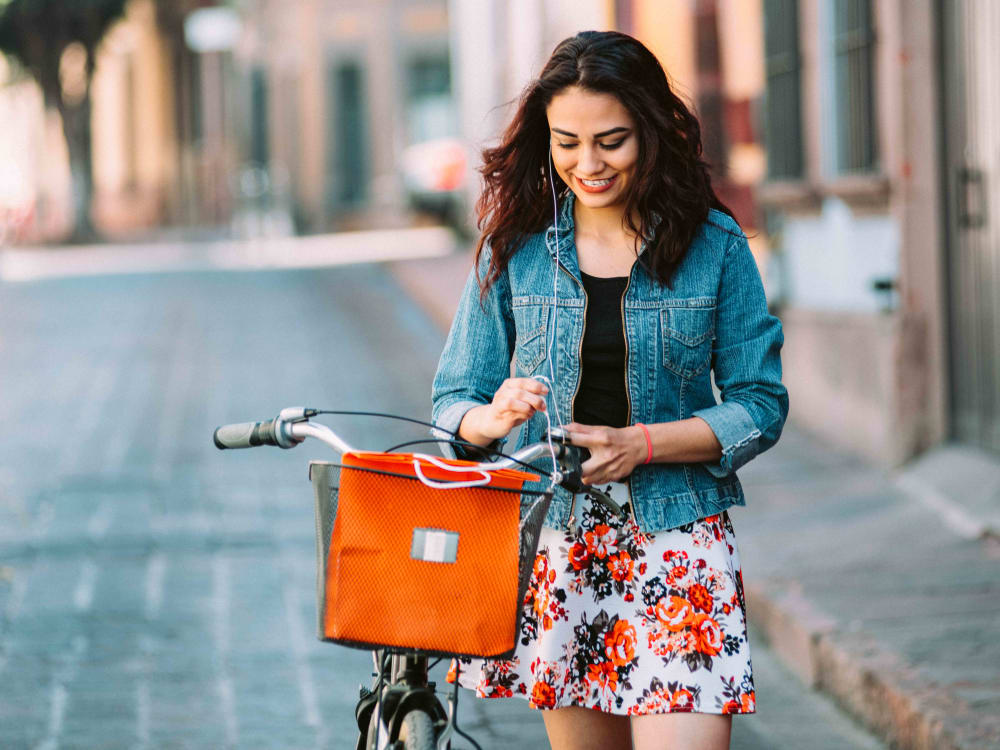 Resident enjoying conveniences accessible by bike at Anson in Burlingame, California