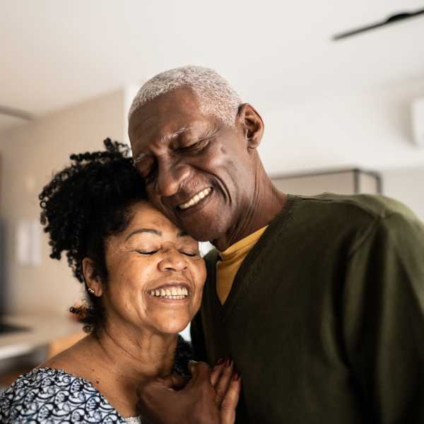 A happy couple in their apartment at Attain at Towne Centre, Fredericksburg, Virginia