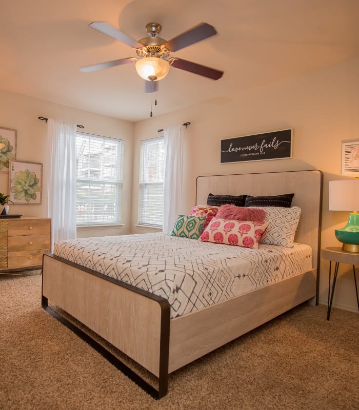 Chic bedroom with ceiling fan at The Park on Westpointe in Yukon, Oklahoma