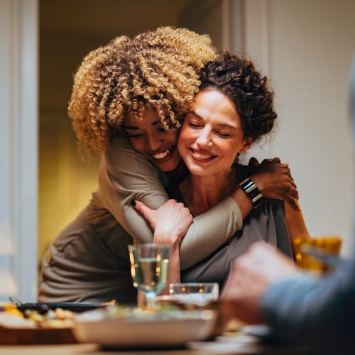 Residents hugging near The Crescent at 161 in Walls, Mississippi