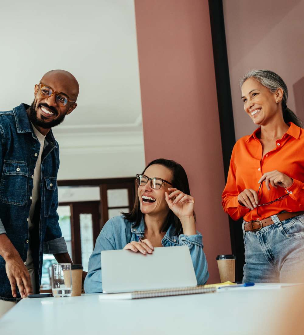 Coworkers laughing together at AMP Residential in Grand Rapids, Michigan