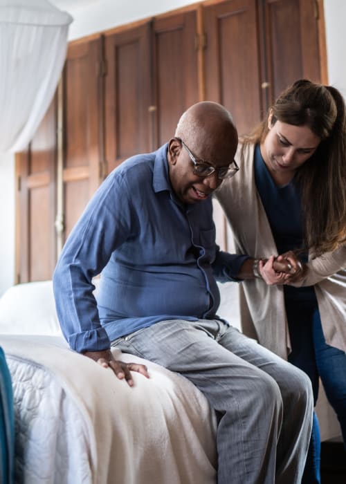 Caretaker helping a resident start their day at Doylestown Health Care Center in Doylestown, Ohio