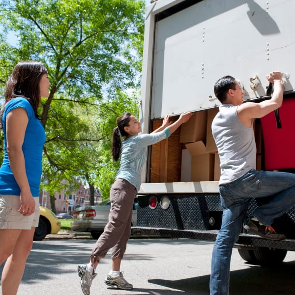 Family loading a moving truck for storage at Storage Units in Aiken, South Carolina