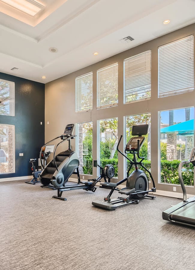 Fitness center with cardio equipment at Alicante Apartment Homes in Aliso Viejo, California