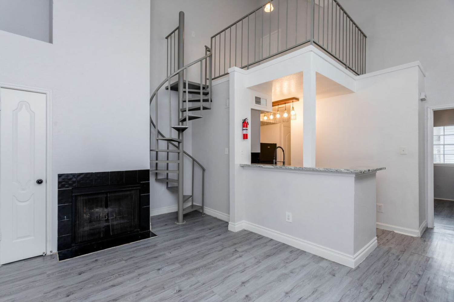 Combined view of the living room and the kitchen at Pine Lake Village in Houston, Texas