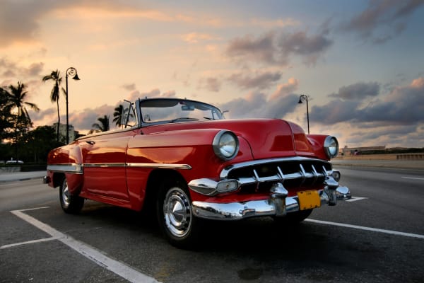 A classic convertible with red paint