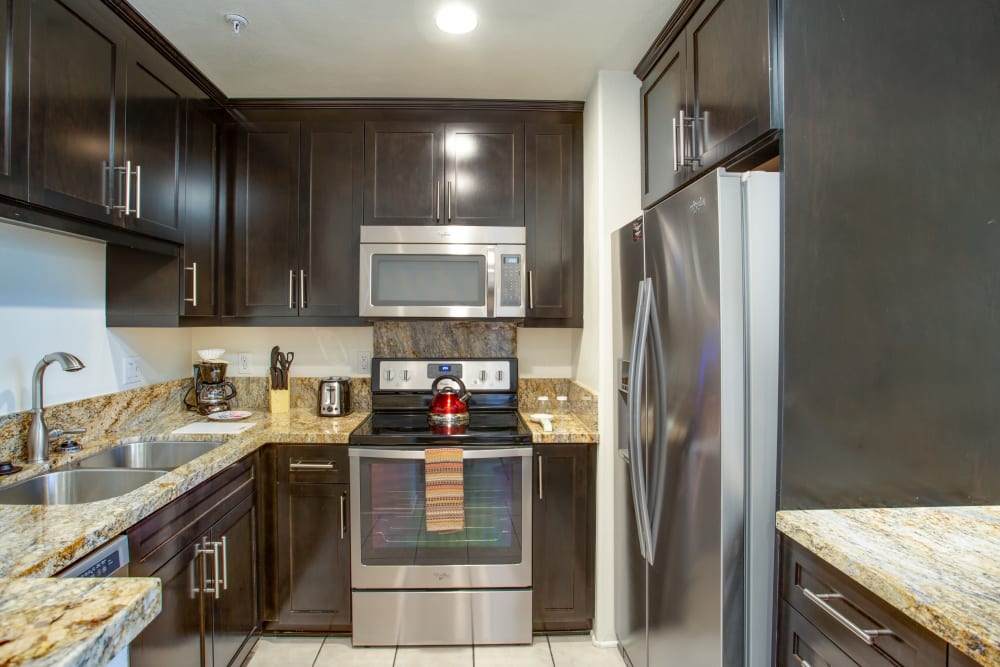 Kitchen in a one bedroom apartment at L'Estancia