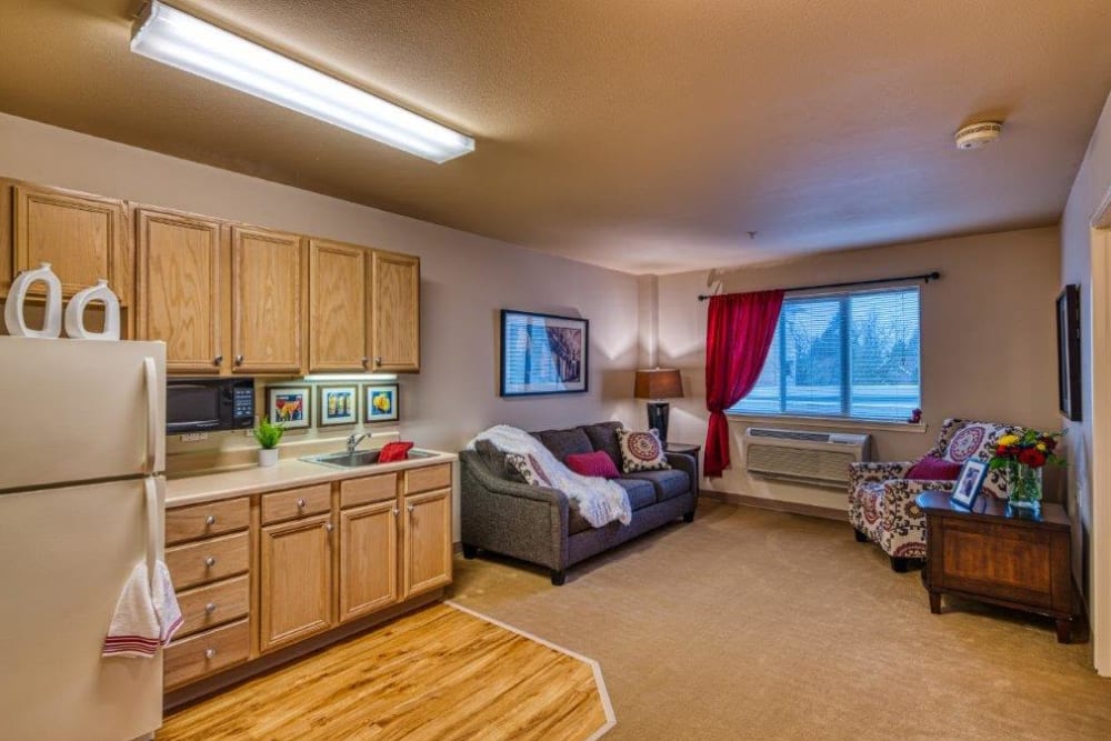 Resident kitchen and living room at Patriots Landing in DuPont, Washington. 