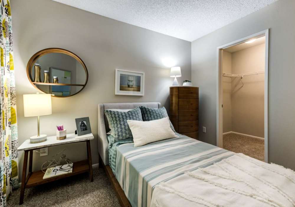 Modern bedroom with side lamp at The Bluffs in Rancho Cucamonga, California