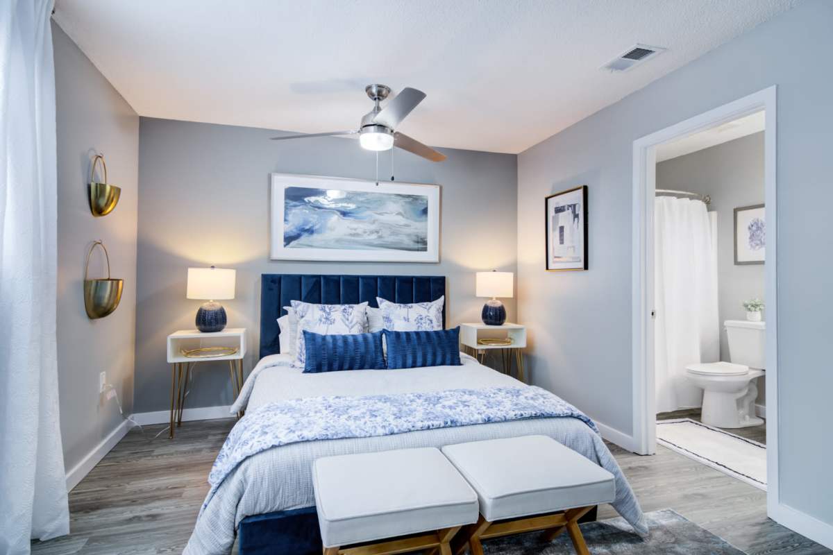 Bedroom with king size bed and ensuite bathroom at Kenridge Apartments in Decatur, Georgia
