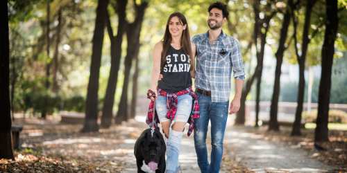 Couple on a walk with their dog in the park near Carrington Point in Douglasville, Georgia