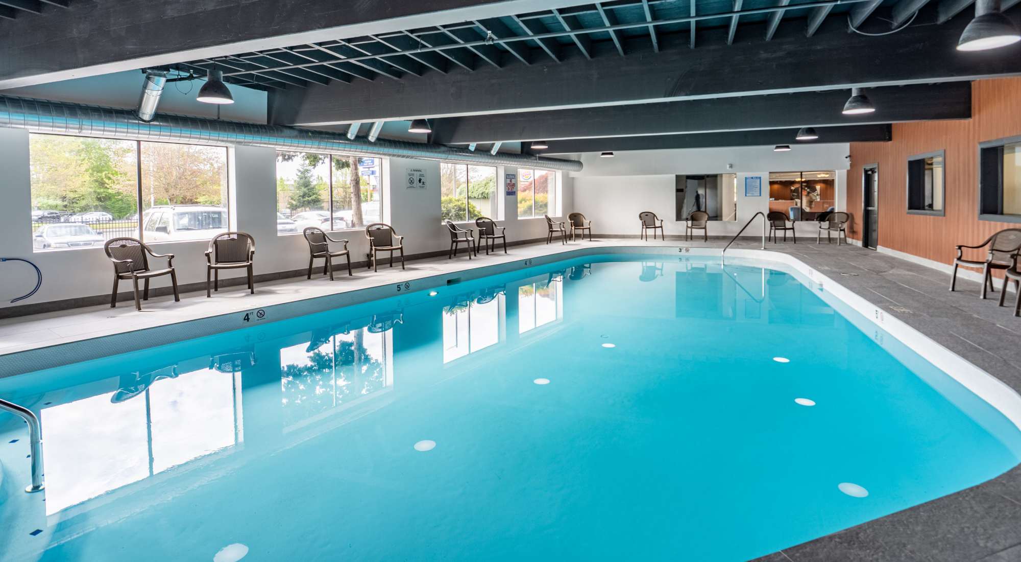 Indoor swimming pool with sauna at Thea Apartments in Tacoma, Washington