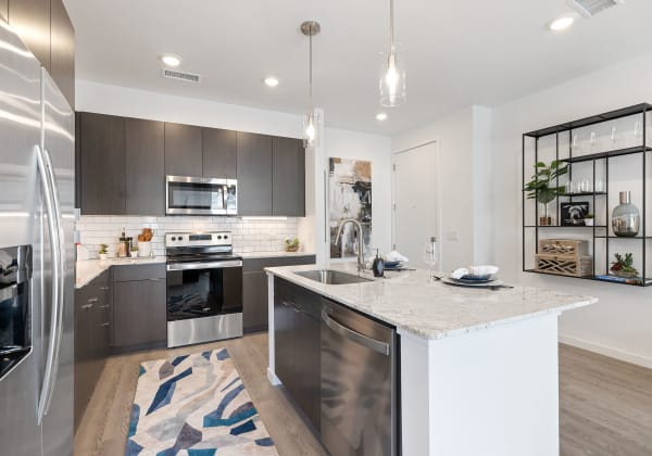 Apartment kitchen at Marq Promenade in Westminster, Colorado
