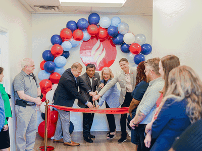 Liberty team at ribbon cutting for the Liberty Learning Academy