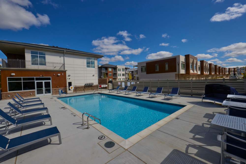 Swimming pool with lounge chairs at Uptown Ann Arbor in Ann Arbor, Michigan