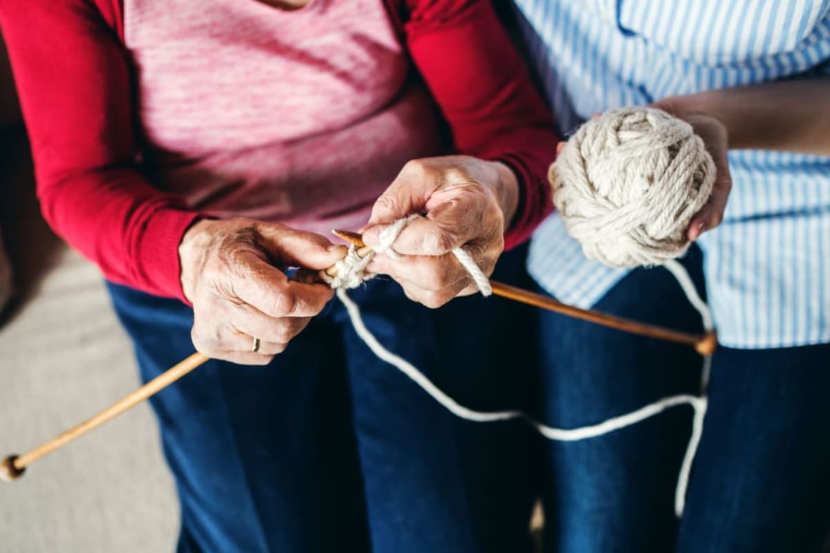 Two residents knitting at Madison House in Norfolk, Nebraska