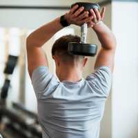 Fitness center at McCart Apartment Homes in Fort Worth, Texas