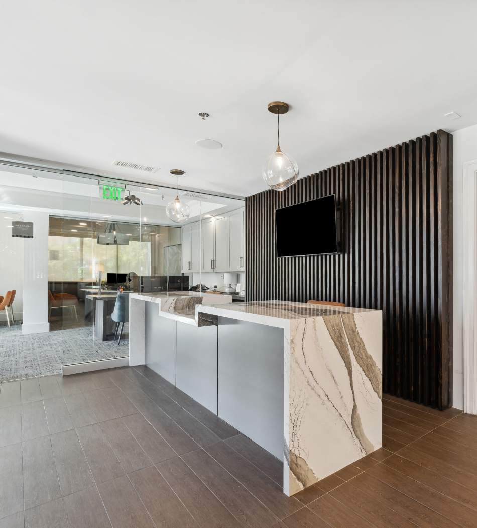 Modern community clubhouse with comfortable seating all over at Sofi Lyndhurst in Lyndhurst, New Jersey