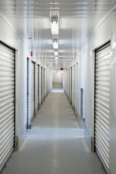 A hallway of indoor storage units at Storage World