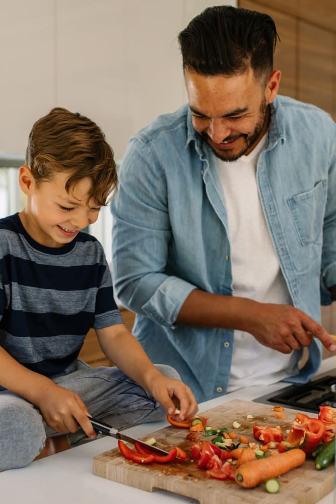 Resident cooking with his son at 3Fifty8 in Lexington, Kentucky