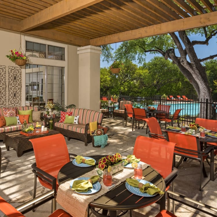 A relaxing covered patio by the pool at one of Management Support's properties