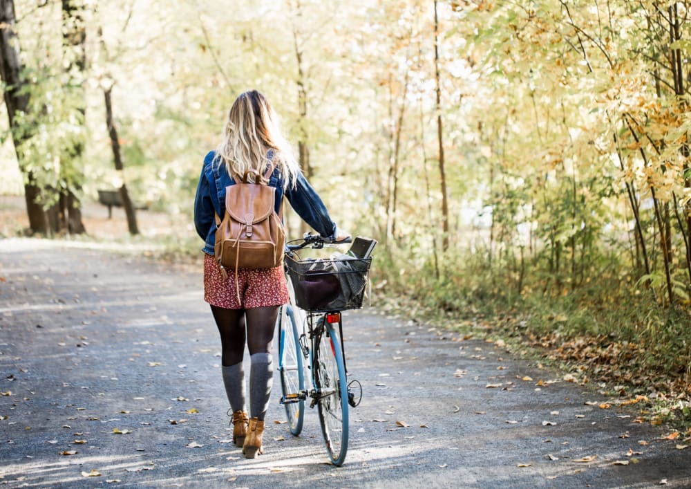 Resident biking on a path near Allegria at Roseville in Roseville, California