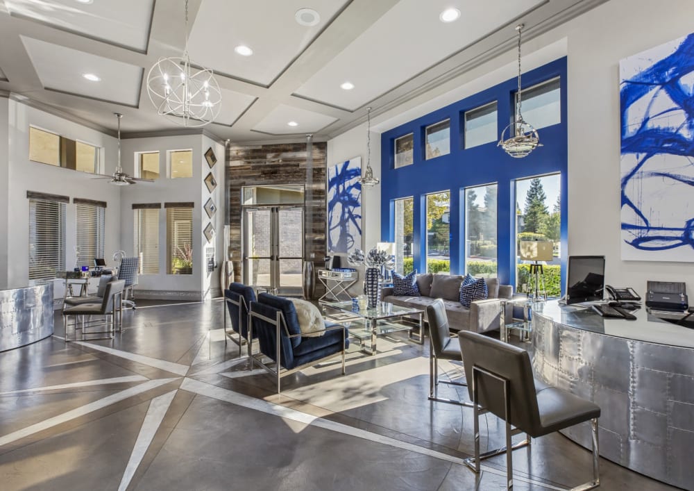 Elegant lounge area with large windows at Meridian at Stanford Ranch in Rocklin, California