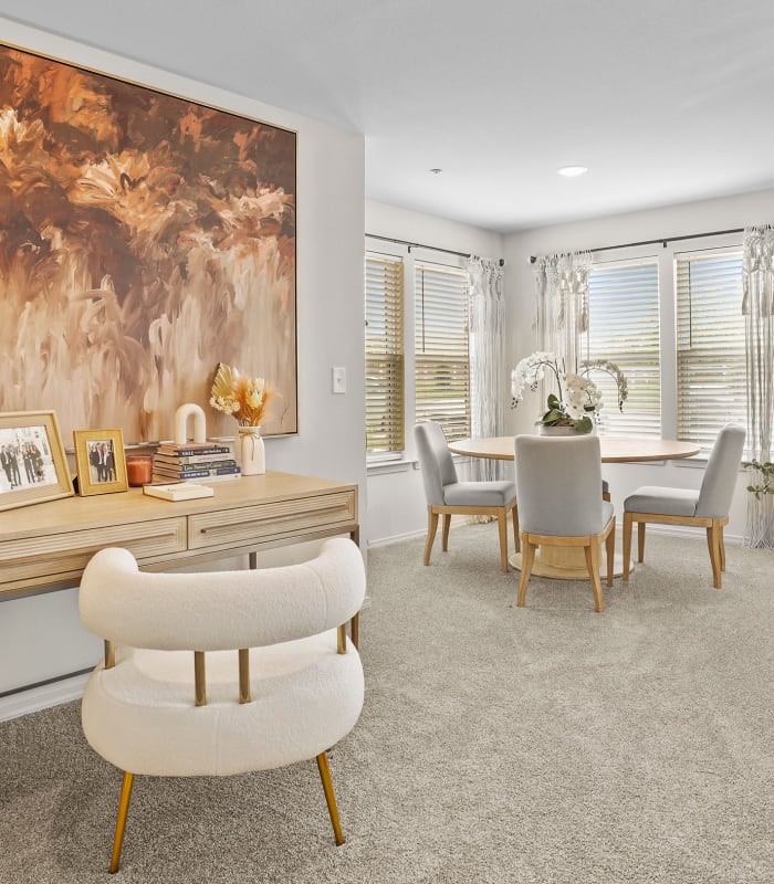 Carpeted living room at Center 301 Apartments in Belton, Missouri