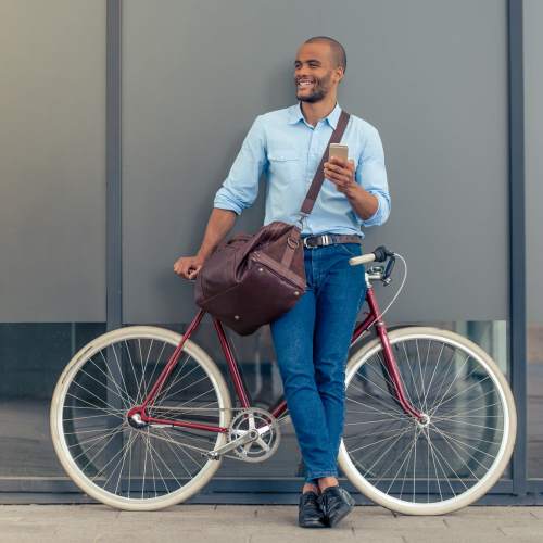 Man with his bike in downtown at Seapointe Villas in Costa Mesa, California