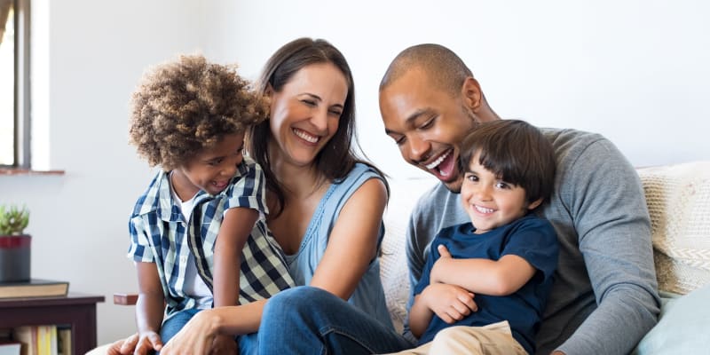 A family relaxing in a home at El Centro New Fund Housing (Officers) in El Centro, California