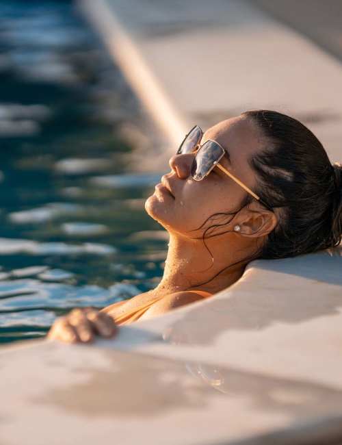A resident woman in the community pool at Orchard Trace Gastonia in Gastonia, North Carolina