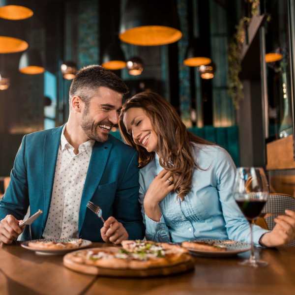 Couple having food at their favourite restaurant near Ontario Town Square Townhomes in Ontario, California