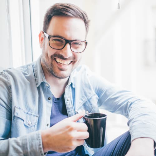 A happy resident having his coffee at Sampson Road in Dahlgren, Virginia