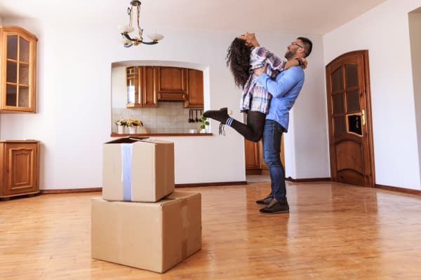 A happy couple moving into their new home in Bangor, Maine