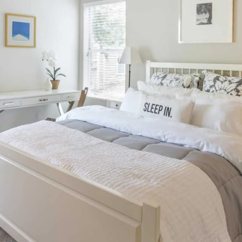 A furnished bedroom with a window at Copper Range in Colorado Springs, Colorado
