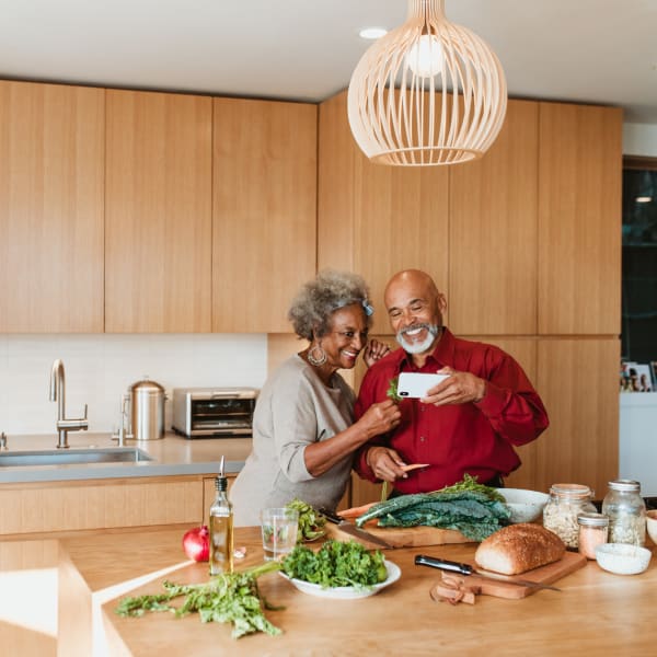Two residents cooking food at Monte Vista Village in Lemon Grove, California.