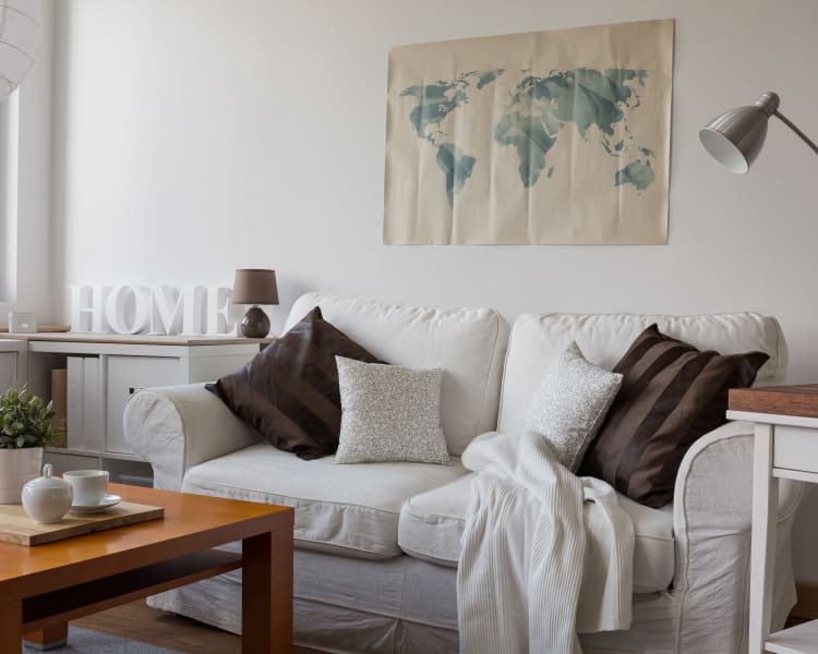 Living room with a comfortable couch in a model home at Canyon View in Las Vegas, Nevada