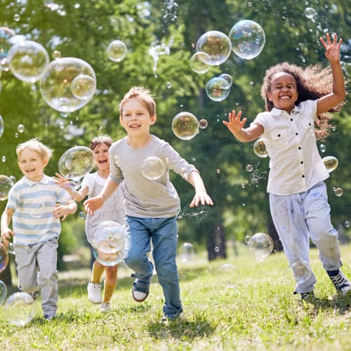 Children playing with bubbles at Midway Manor in Virgina Beach, Virginia