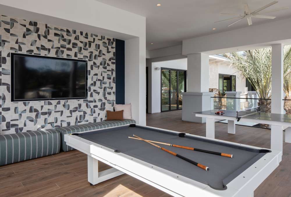 Resident friends playing billiards at RIVA Solana Beach in Solana Beach,California