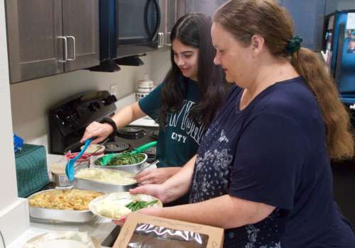 Mother and daughter cooking together at Juniper Creek in Austin,Texas 