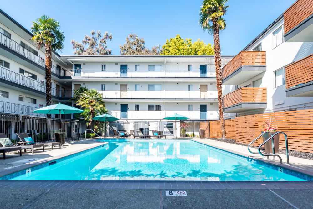 View of the swimming pool area from an upper floor at Sofi Redwood Park in Redwood City, California