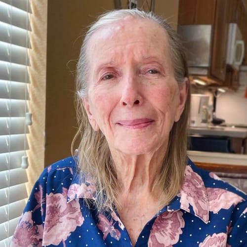 Smiling resident at Oxford Glen Memory Care at Sachse in Sachse, Texas