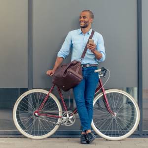 Resident biking home from the office at The Hills in San Diego, California