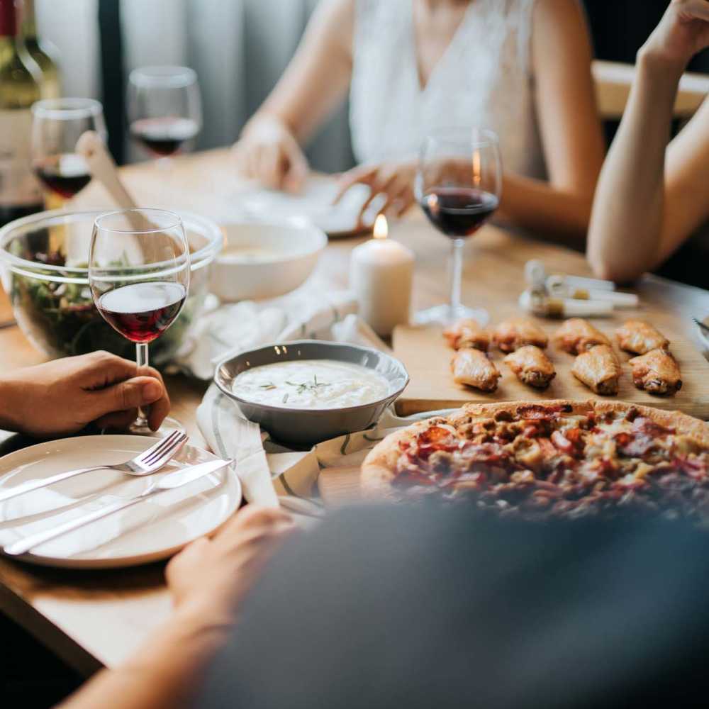 Residents having lunch together in a restaurant near Breeze Apartments in Gulf Breeze, Florida