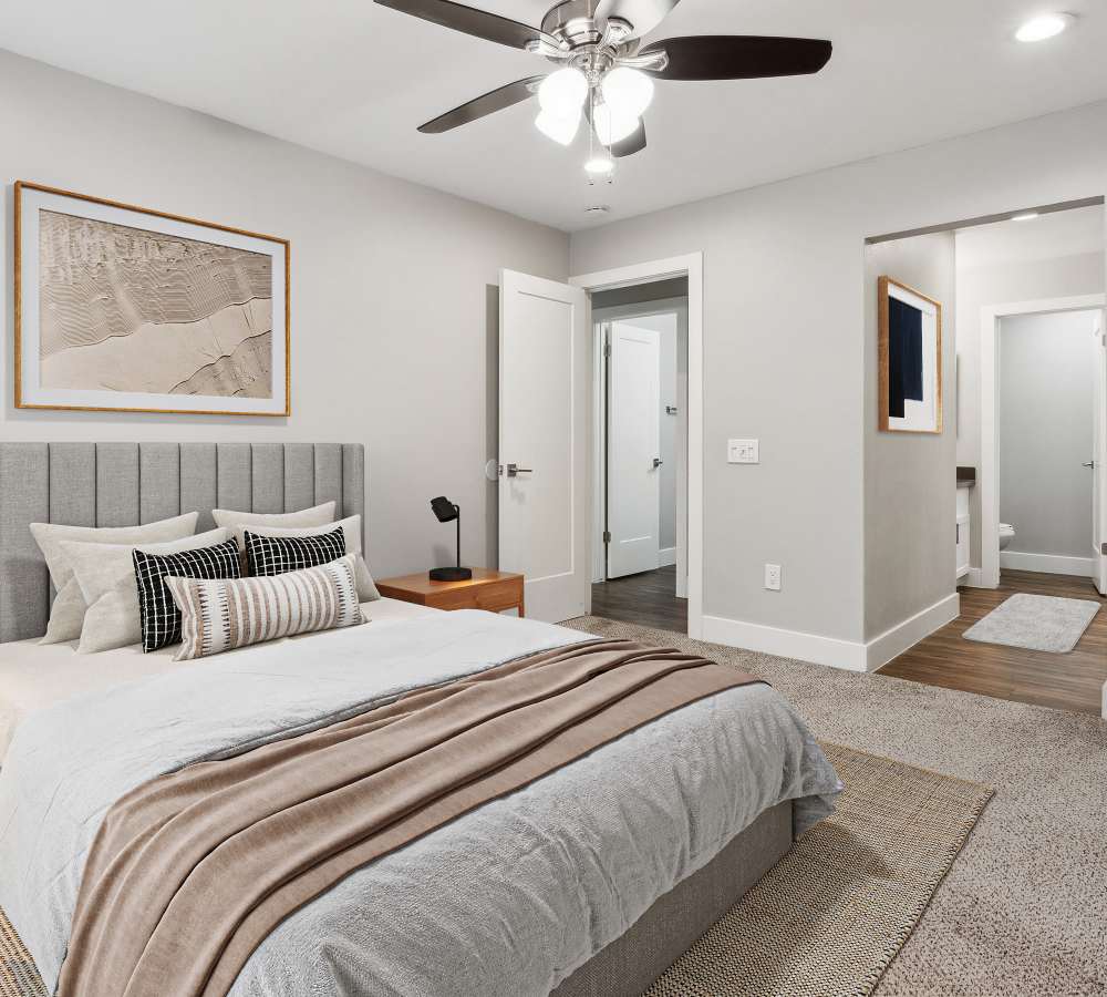 Bedroom with carpet and ensuite bathroom at Muirwood Apartment Homes in Martinez, California