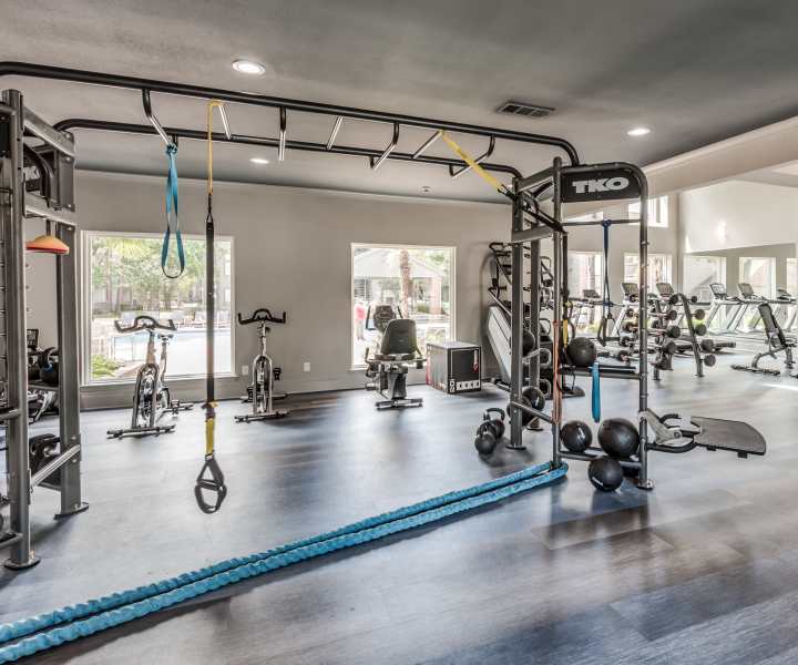 Fitness center with equipment at The Haven On Buoy in Webster, Texas