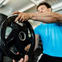 Resident working out in gym at Las Torres Apartments in El Paso, Texas